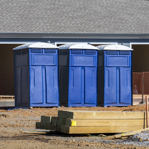 what is the cost difference between standard and deluxe portable toilet rentals in Fort Defiance